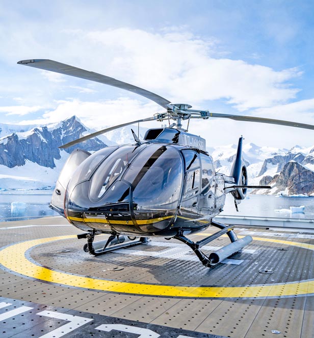 Scenic Eclipse Helicopter in Recess Cove, Charlotte Bay, Antarctica